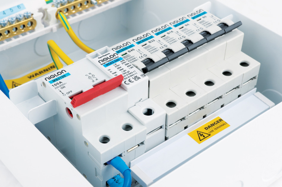A white box containing various electrical components and wires, arranged for assembly or repair purposes.